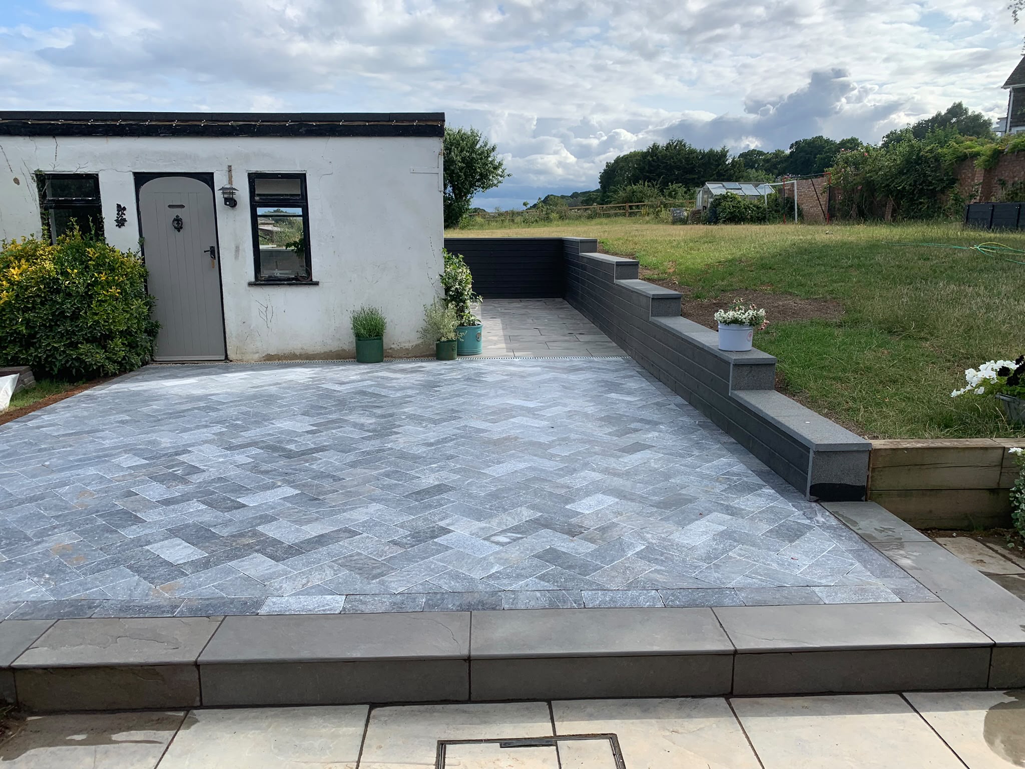 Herringbone porcelain patio completed by PM Gardens & Driveways